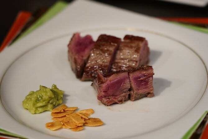 Hidden Gem Food & Whiskey Night Tour near Roppongi - Stop 1 in Azabujuban: yakitori, wagyu, sashimi, treats, and oden