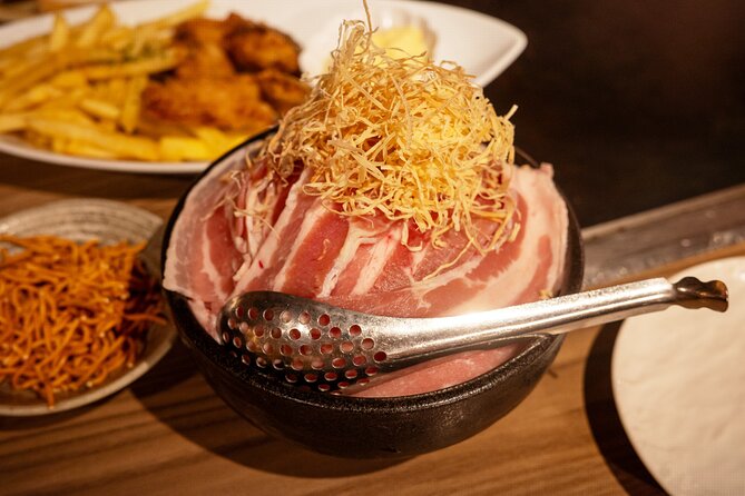 Private Bar Hopping Tour in Shinjuku Golden Gai - Stop 2: an izakaya dinner built around three dishes and a drink
