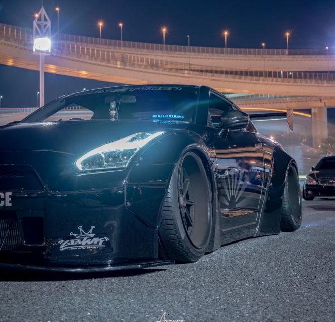 Secret Car Meet: R34 Skyline Car Club Membership - Photo stops and Tokyo skyline views, including Tokyo Tower and Rainbow Bridge