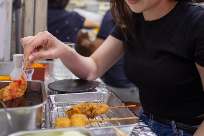Shibuya by night in Small Groups: Neon Lights and Local Flavors - Center-gai: photos, Korean corndog or takoyaki, and that 10-yen moment