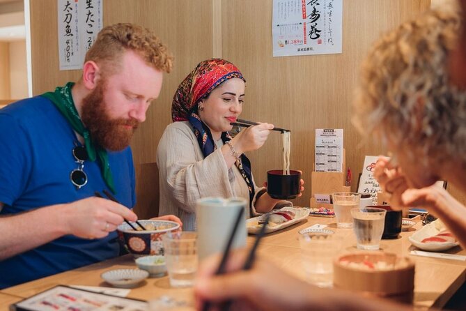 Tokyo After 5: Authentic Japanese Food & Drink Night Tour - Stop 3: Tsukishima Monja Street, monjayaki cooked on the grill
