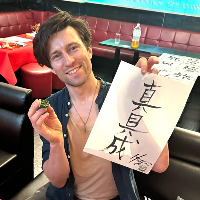 Tokyo: Calligraphy on Kanji Fan & Scroll with Drink - Writing your name on the uchiwa fan and kakejiku hanging scroll