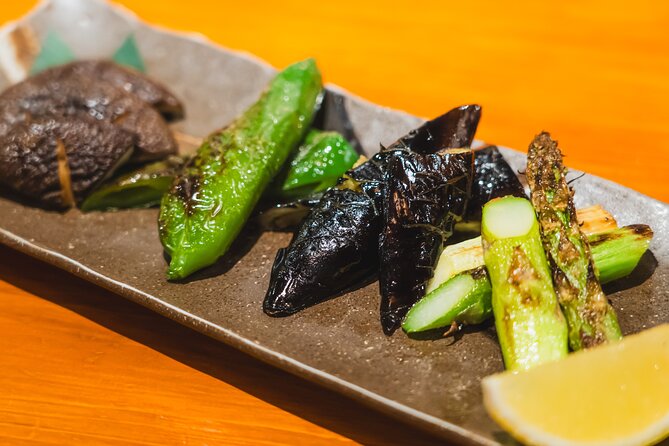 Tokyo Ginza Authentic Food Tour (Izakaya Hopping by local guide) - Ginza Mitsukoshi photo moment by the Seiko clock tower