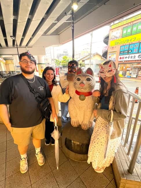 Tokyo: Gotokuji Cat Temple, Shinjuku Cat Cafe & 3D Cat Tour - Gotokuji shopping street: cat snacks and local souvenir energy