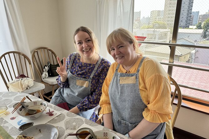 Tokyo Haneda: Bento & Ramen Gyoza Cooking Class in a Local home - The table meal and the free-flow drinks that change the mood