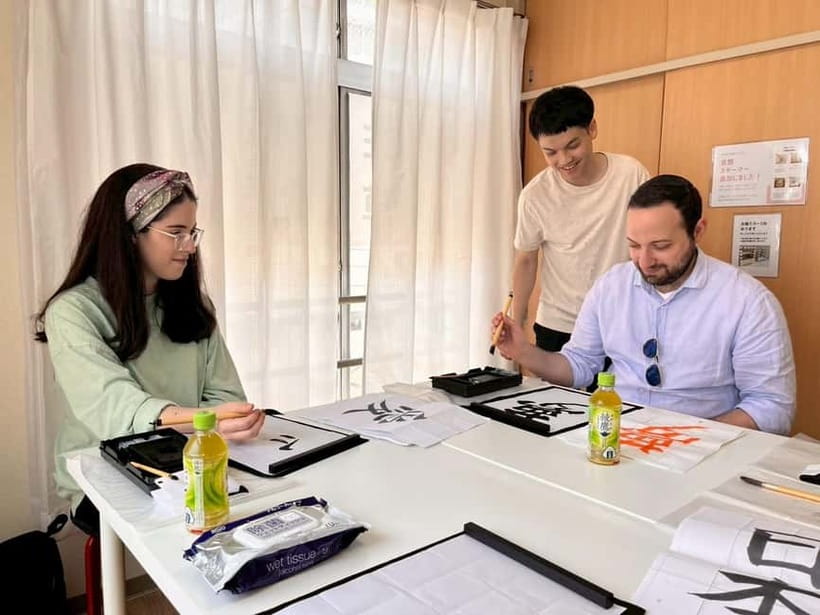 Tokyo: Japanese Calligraphy Lesson with Skilled Instructor - Practicing on hanshi, with enough paper to fix your mistakes