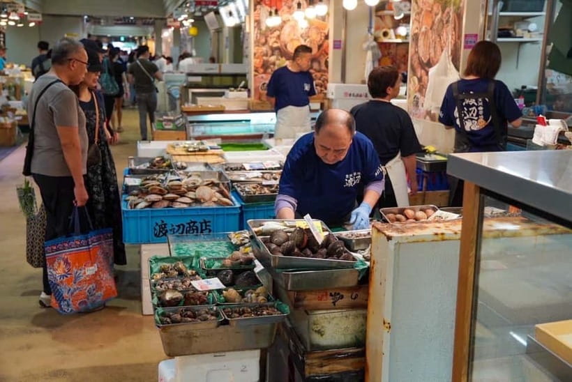 Tokyo: Private Tsukiji Street Food & Sake with Local Guide - Finding Your Guide at Tsukiji Hongwanji, Then Letting Your Nose Lead