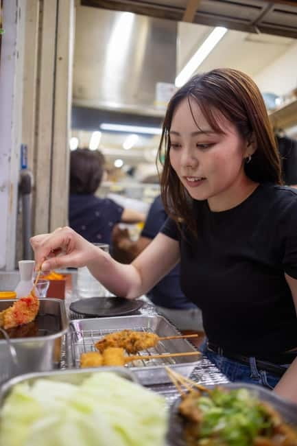 Tokyo: Shibuya Food Tour, Neon Lights & Local Flavors - Konbini snack stop: egg sandwich, onigiri, and crispy fried chicken