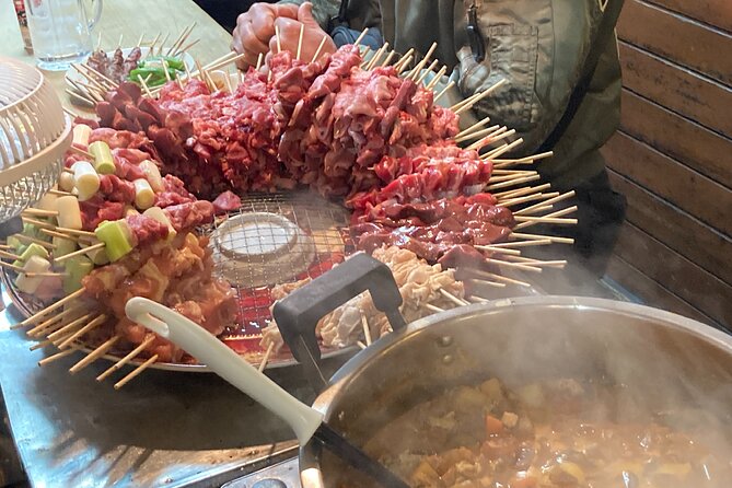 Tokyo Shinjuku Japanese Local Bar Hopping and Food Tour - Stop 1: Omoide Yokocho street-food alley at full night mood