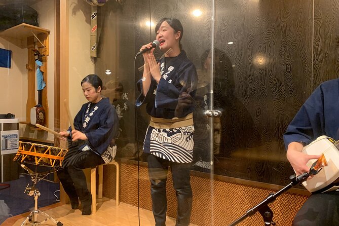 Tsugaru shamisen performance over traditional dinner - Asakusa at 5:30 pm, when the streets feel human